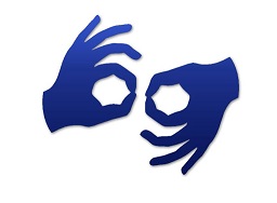 Dwie dłonie, granatowe na białym tle, pokazujące znak w języku migowym